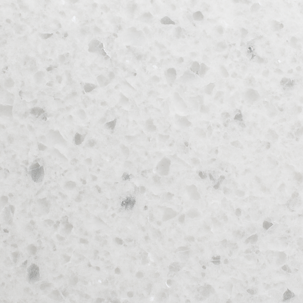 Close-up of a spotless white quartz countertop surface